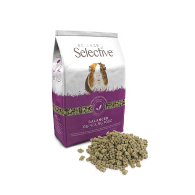 A bag of Science Selective Balanced Guinea Pig Food with a guinea pig image on the packaging. The bag is white and purple, featuring a clear product name and key benefits. In front of the bag, a pile of small, uniform, pellet-shaped guinea pig food is displayed.