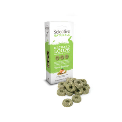 A box of Selective Naturals Orchard Loops, a snack for rabbits and guinea pigs, in Timothy hay and apple flavor. The packaging is white and green, featuring silhouettes of small animals and key product benefits. In front of the box, several green, ring-shaped treats are displayed.